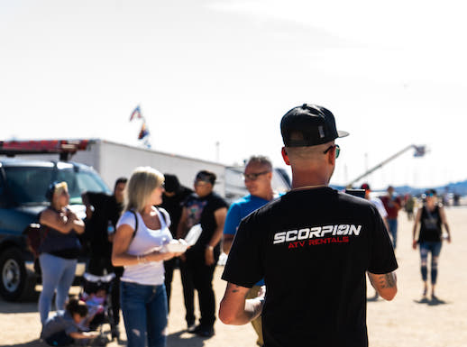 owner wearing scorpion tshirt at event